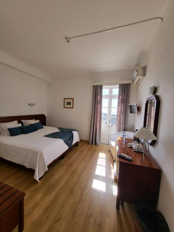 Postel nebo postele na pokoji v ubytování Hotel Beira Mar