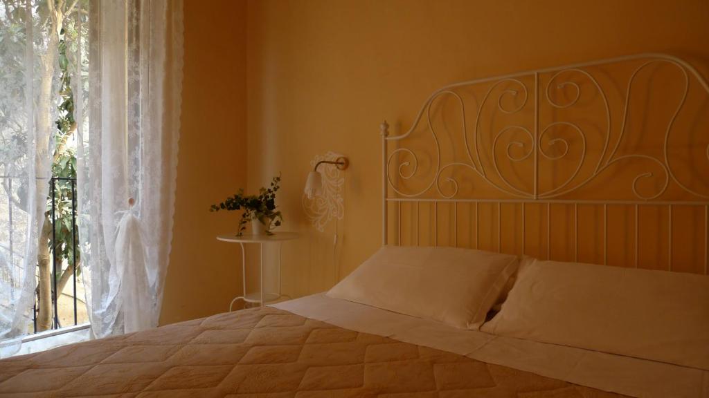 Postel nebo postele na pokoji v ubytování I Tetti di Siciliando
