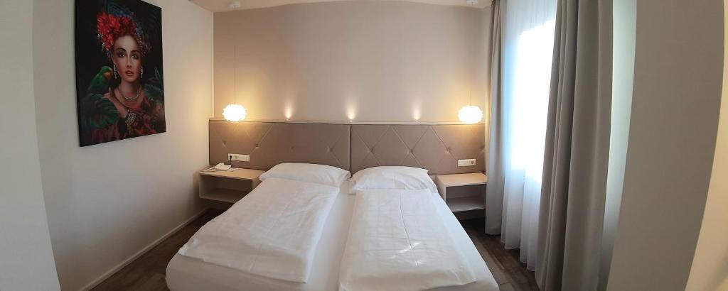 Postel nebo postele na pokoji v ubytování Hotel-Restaurant Gollner