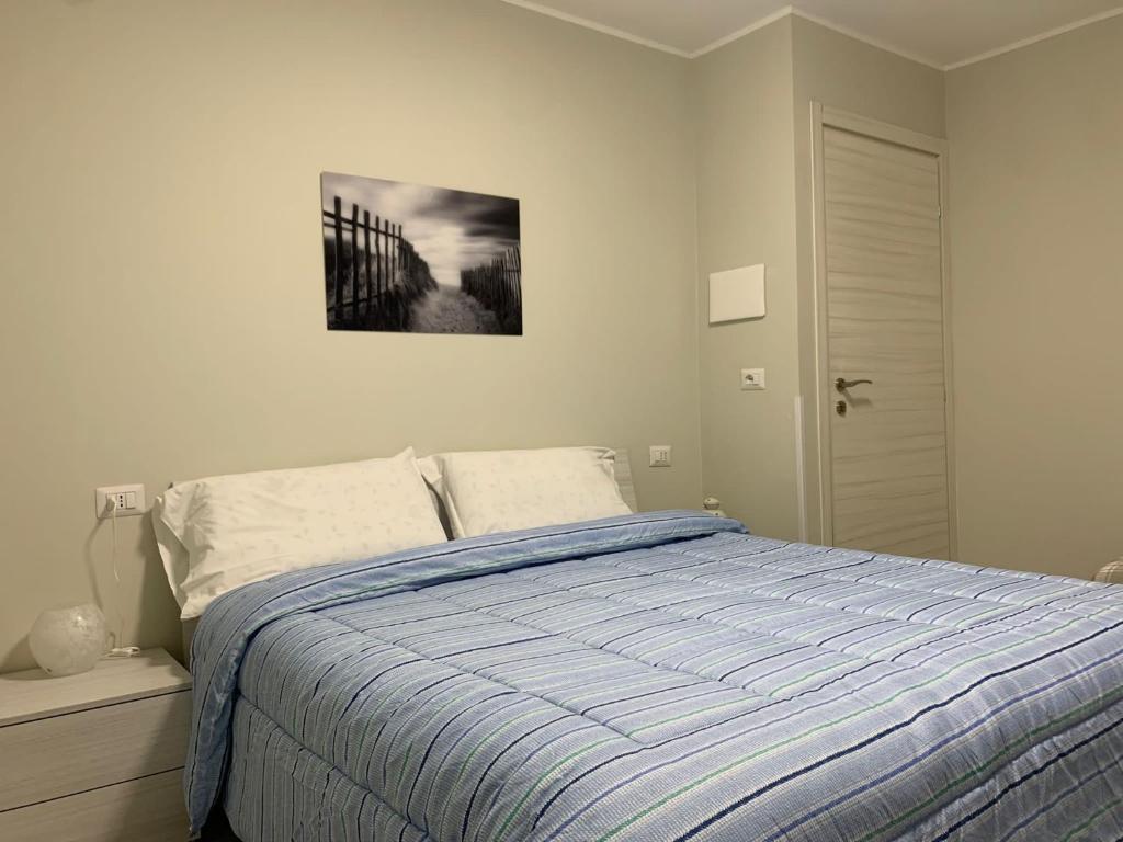 Cama ou camas em um quarto em La Perla Nera Affittacamere