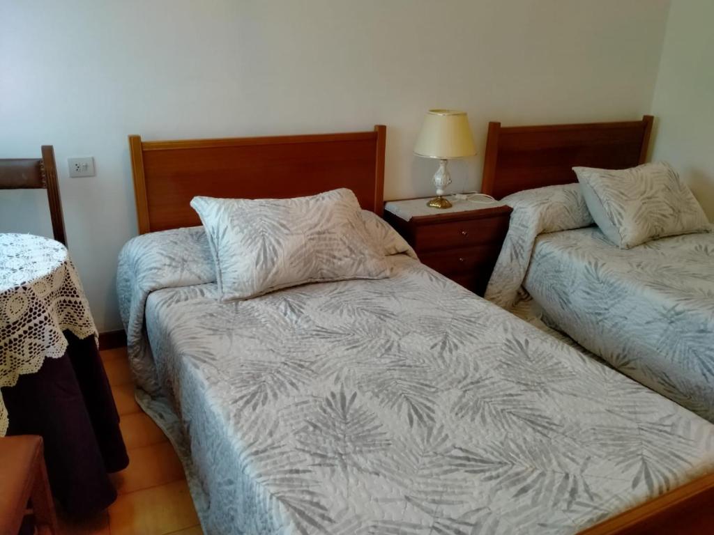 Postel nebo postele na pokoji v ubytování Casa da Fontiña