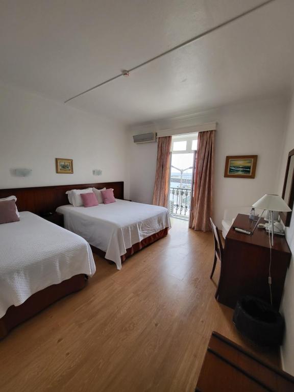 Postel nebo postele na pokoji v ubytování Hotel Beira Mar