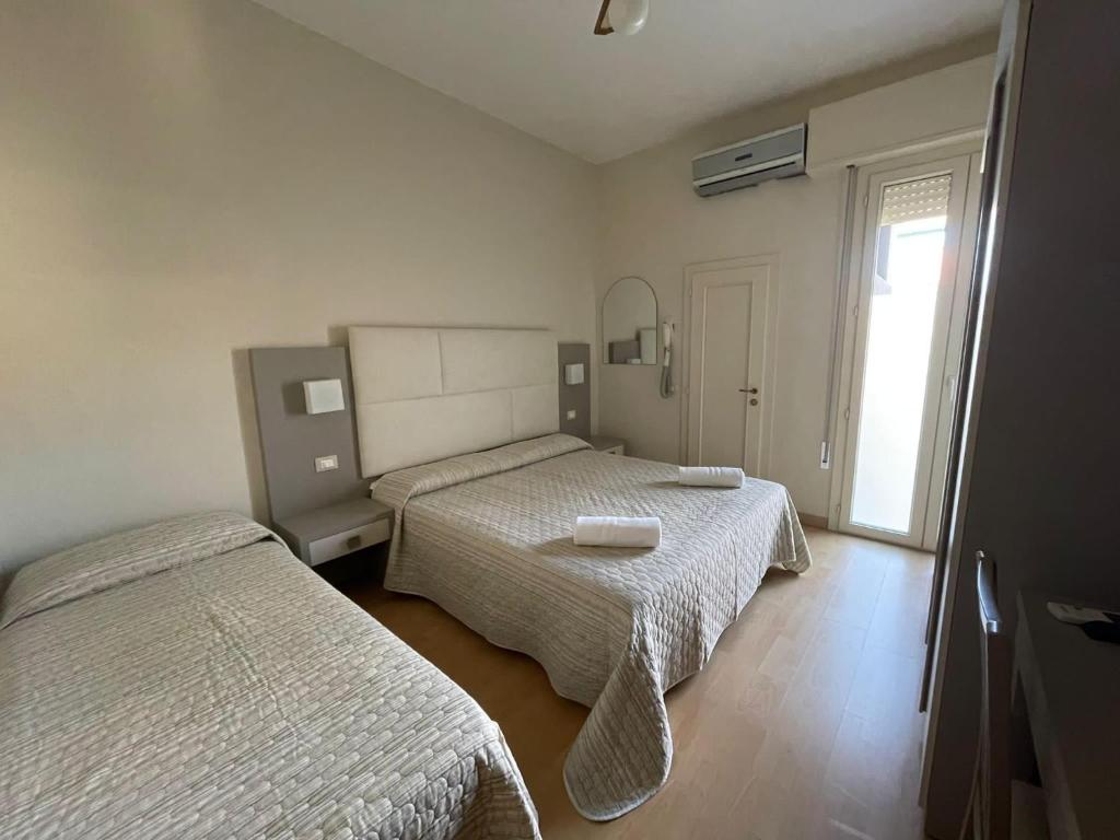 Postel nebo postele na pokoji v ubytování Hotel Vera