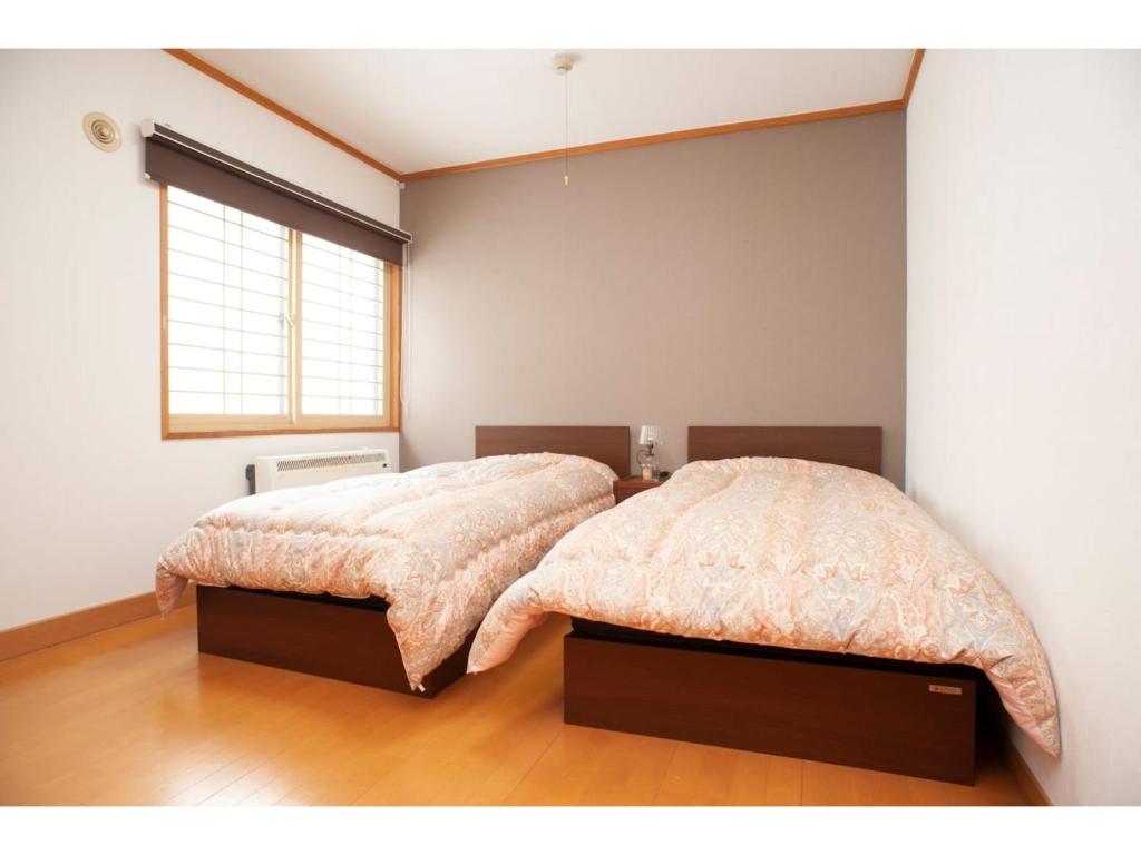 Un pat sau paturi într-o cameră la Guest House Tou - Vacation STAY 26333v