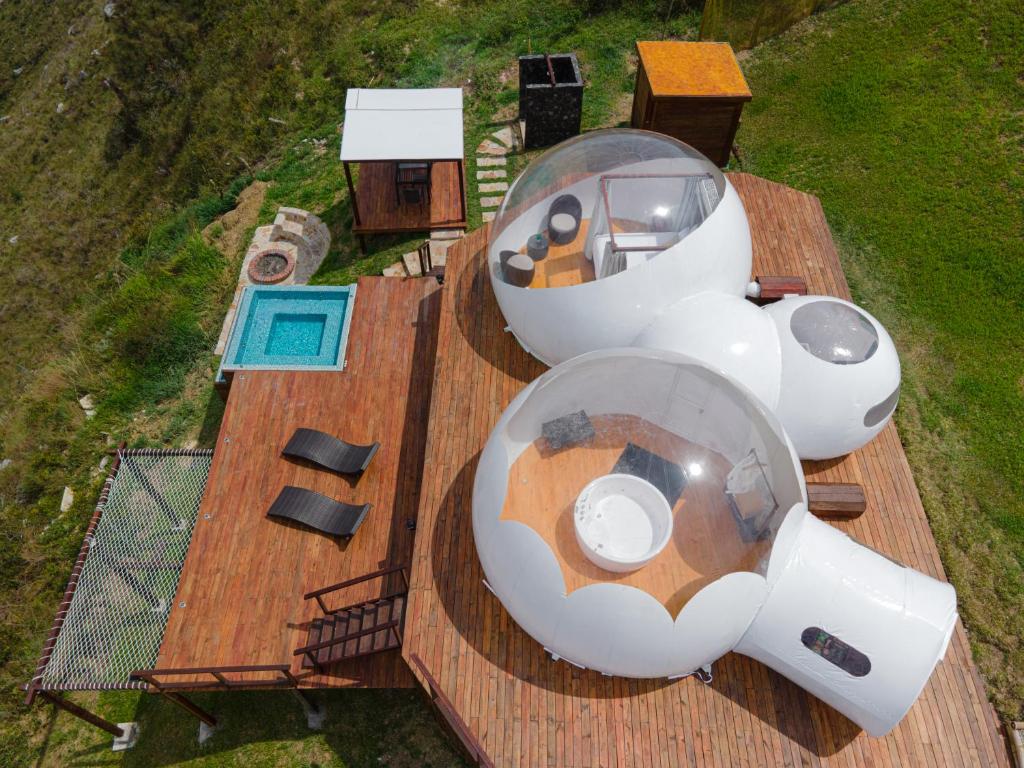 an overhead view of a house on a deck at Monteza Glamping in Piedecuesta