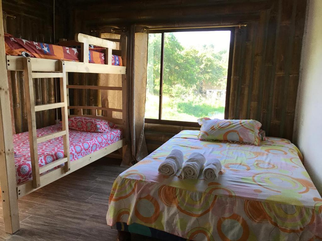 Postel nebo postele na pokoji v ubytování Hostal Fara