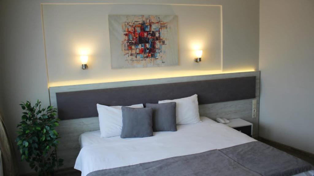 Postel nebo postele na pokoji v ubytování Temizay Hotel