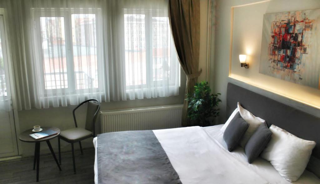 Postel nebo postele na pokoji v ubytování Temizay Hotel