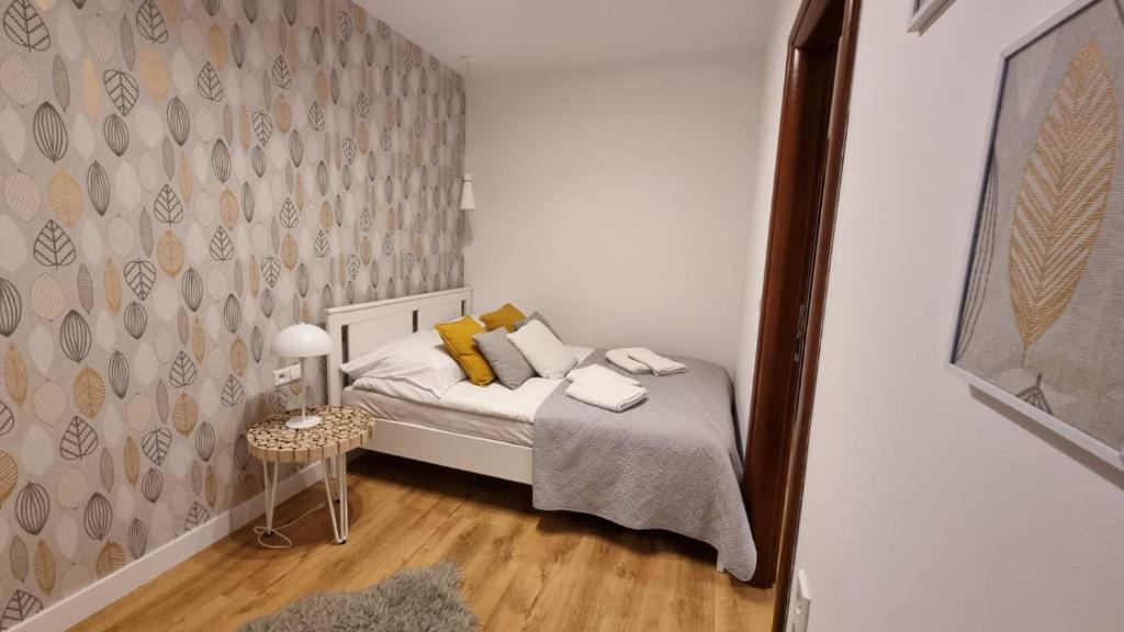 Posteľ alebo postele v izbe v ubytovaní Apart4You Apartamenty Bulwary25