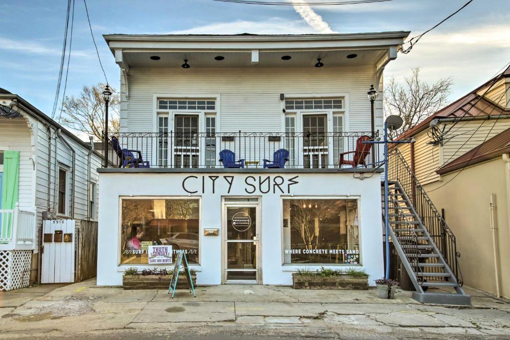 a city spin store in front of a house at Uptown NOLA Apt on Magazine Street with Backyard! in New Orleans
