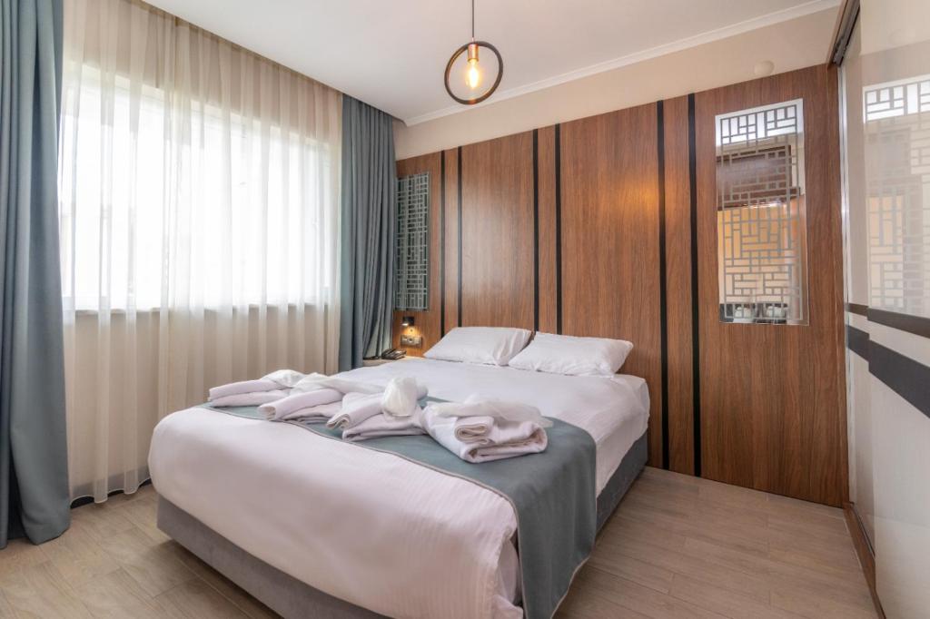 Postel nebo postele na pokoji v ubytování Aforia Thermal Residences