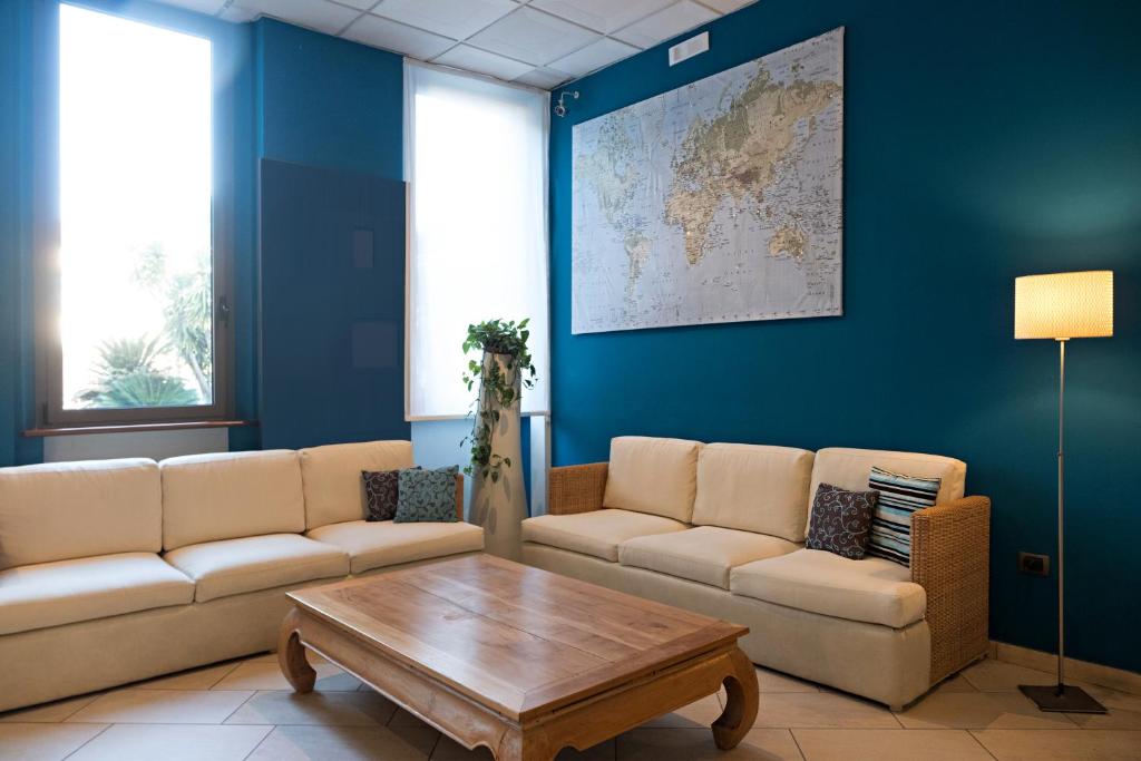 a living room with a couch and a coffee table at Hotel Spinelli in Viareggio