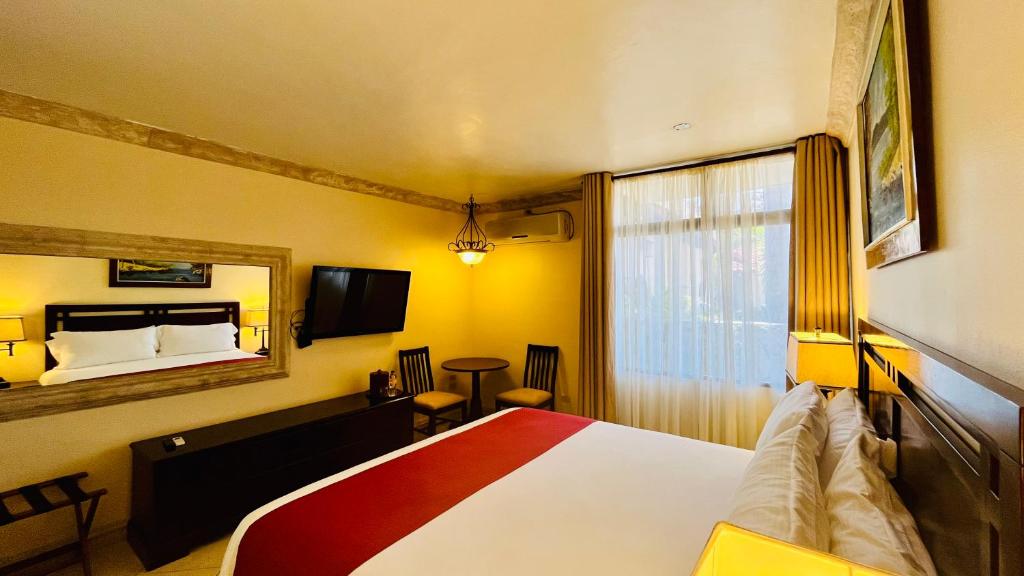 Voodi või voodid majutusasutuse Hotel Alameda toas