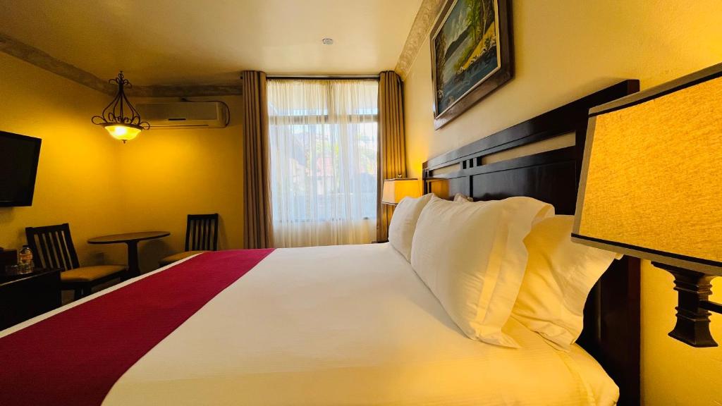 Voodi või voodid majutusasutuse Hotel Alameda toas