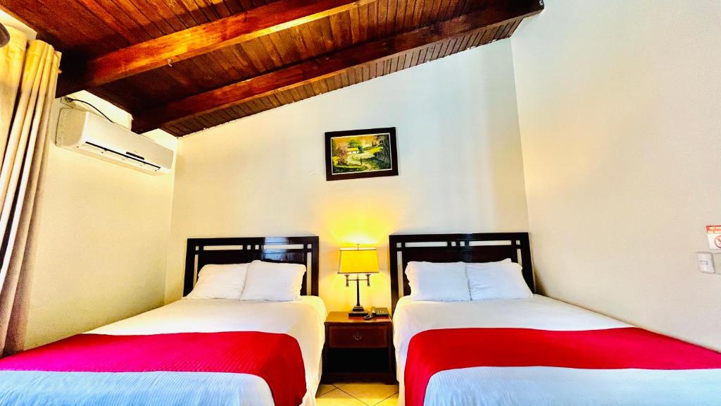 Voodi või voodid majutusasutuse Hotel Alameda toas