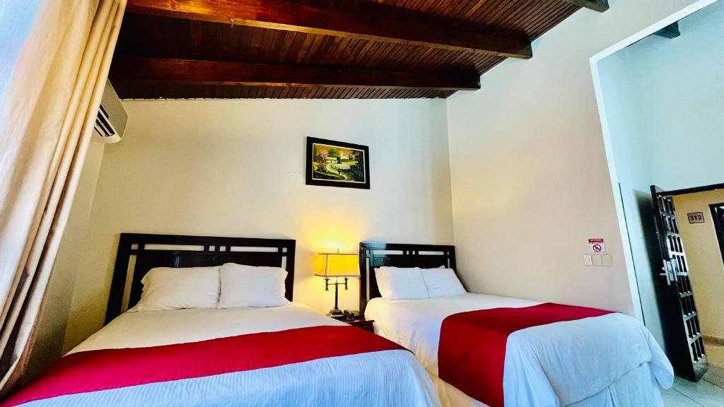 Voodi või voodid majutusasutuse Hotel Alameda toas