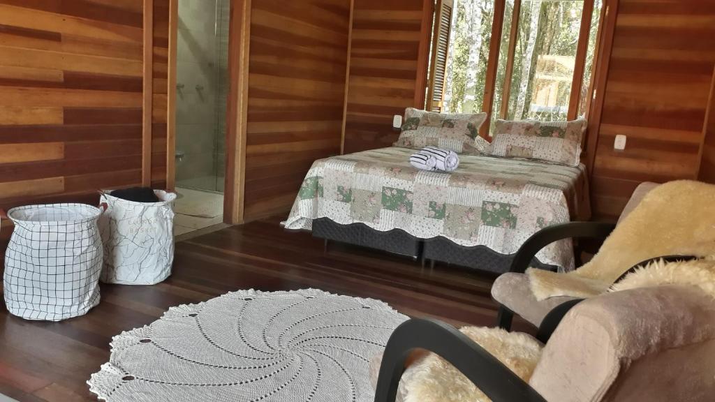 Postel nebo postele na pokoji v ubytování Morada do Xaxim - Chalé Hortência
