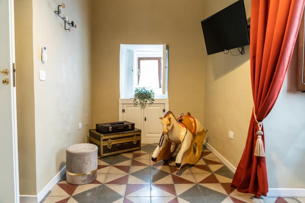 Televízia a/alebo spoločenská miestnosť v ubytovaní TRESCA CHARME luxury Rooms