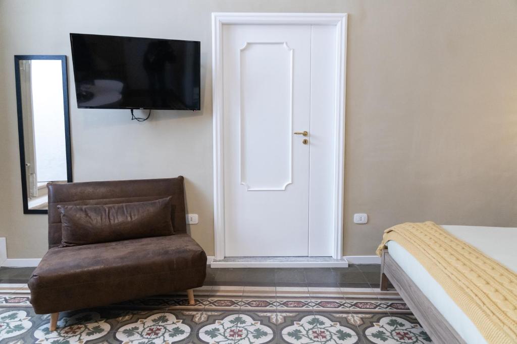 Televízia a/alebo spoločenská miestnosť v ubytovaní TRESCA CHARME luxury Rooms
