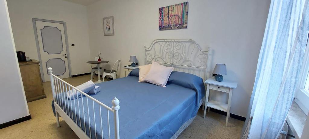 Postel nebo postele na pokoji v ubytování Pippo a Vernazza Rooms