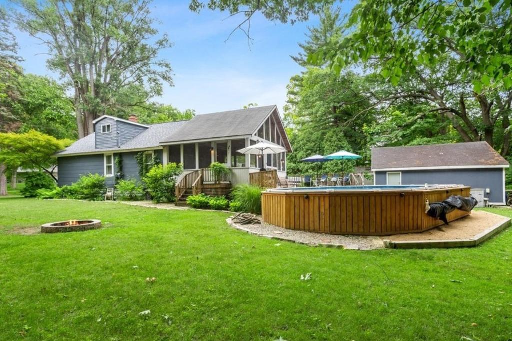 a house with a yard with a hot tub at Anchors Away in New Buffalo