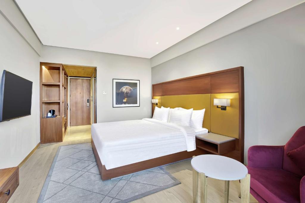Postel nebo postele na pokoji v ubytování Radisson Hotel Nathdwara