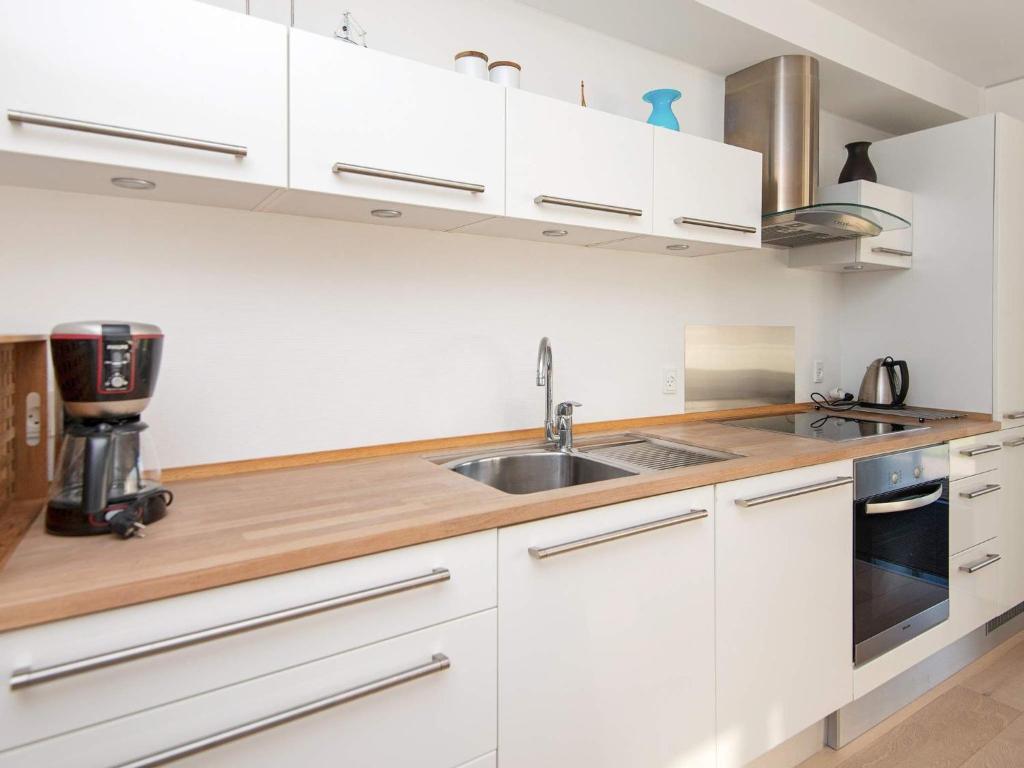 Kuchyň nebo kuchyňský kout v ubytování Apartment Bogense IV