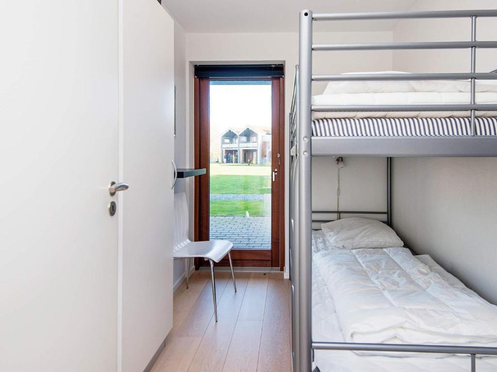 Postel nebo postele na pokoji v ubytování Apartment Bogense IV