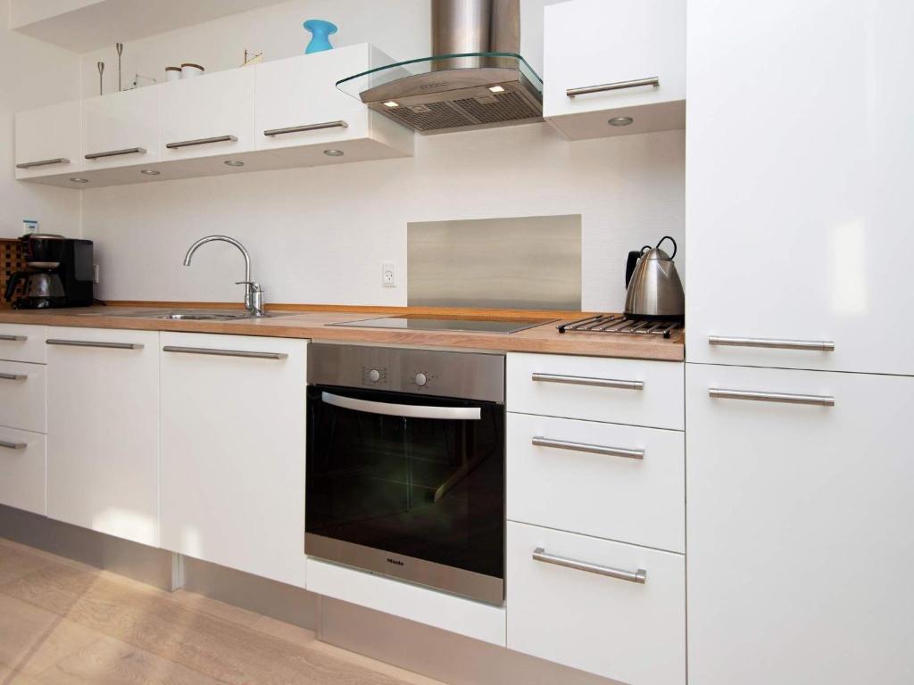 Kuchyň nebo kuchyňský kout v ubytování Apartment Bogense IV