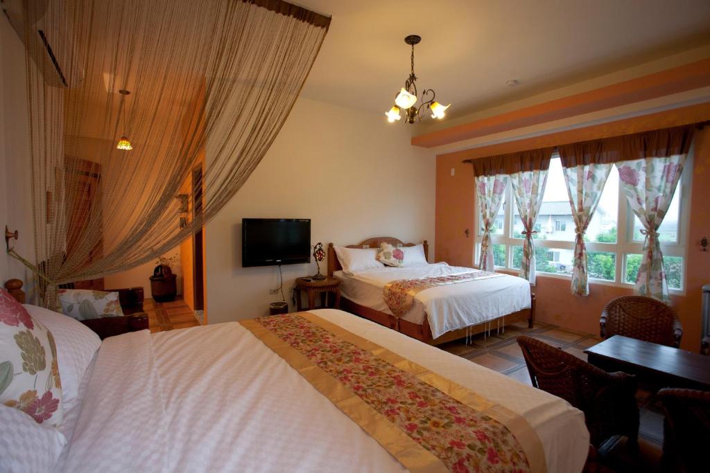 Postel nebo postele na pokoji v ubytování Cloudenjoy B&B