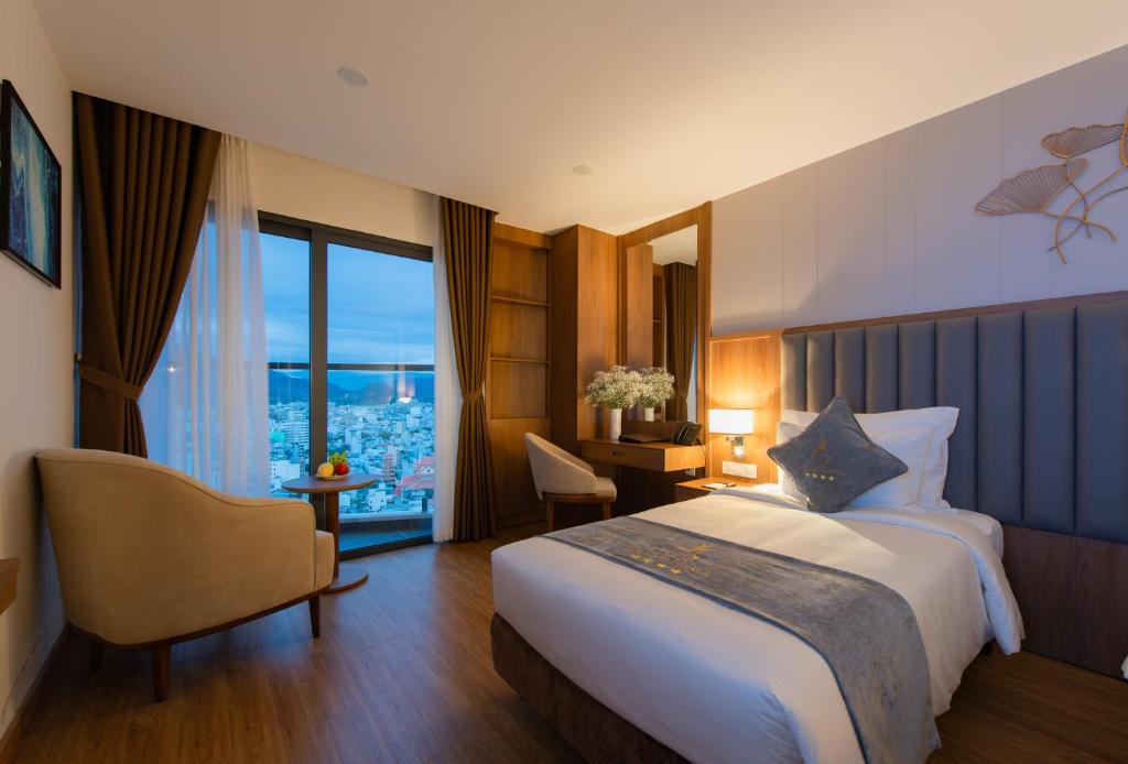 Postel nebo postele na pokoji v ubytování Grand Gosia Hotel
