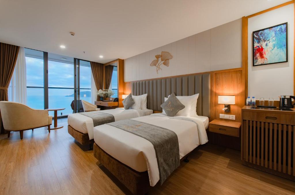 Giường trong phòng chung tại Grand Gosia Hotel