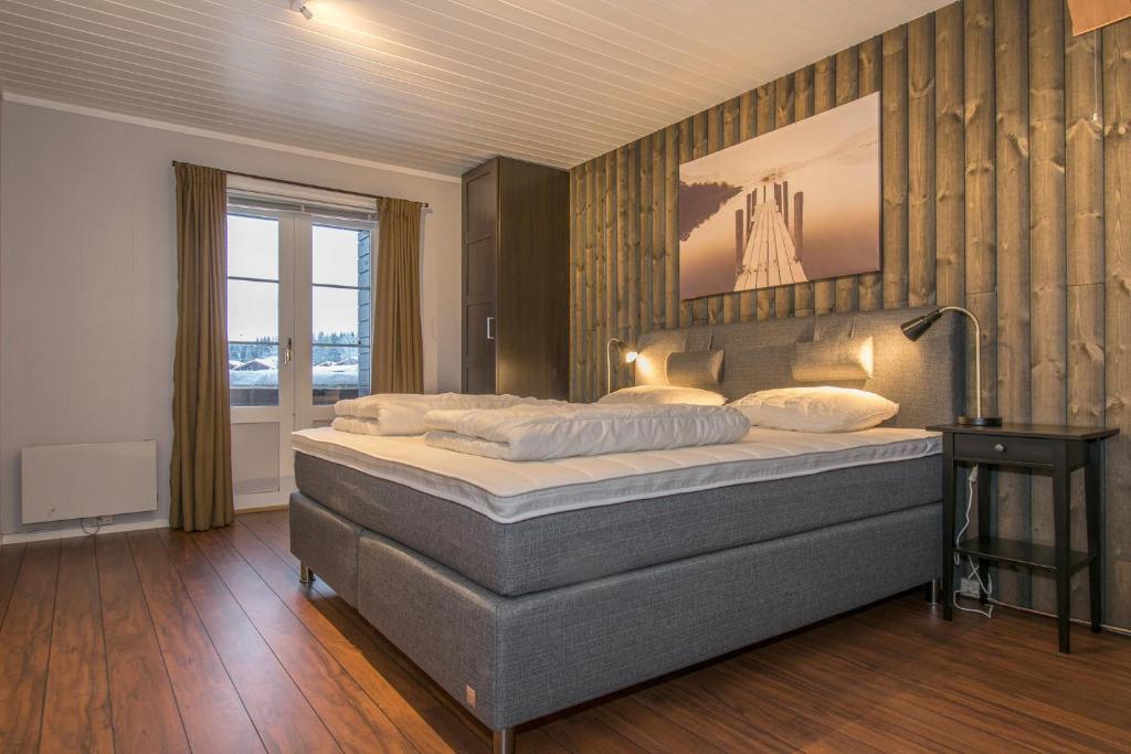 Gulta vai gultas numurā naktsmītnē Trysilfjell Apartment Hotel