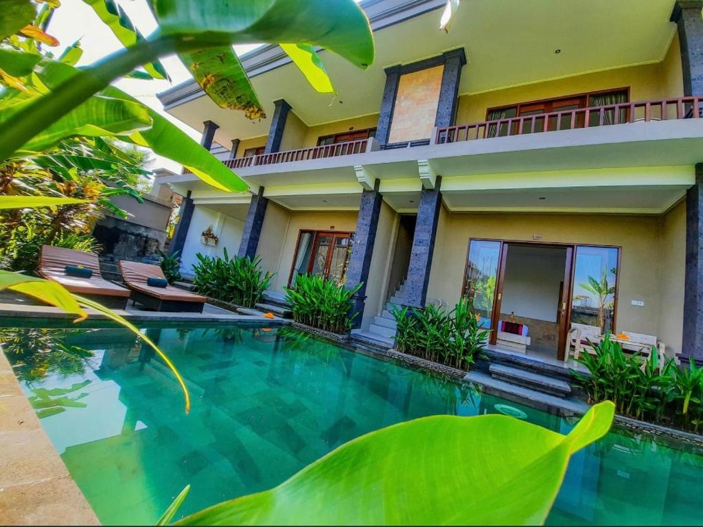 Bazén v ubytování Pulu Sari Suite Ubud nebo v jeho okolí