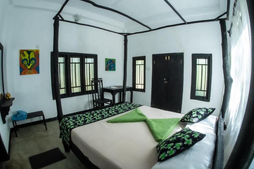 Postel nebo postele na pokoji v ubytování Hotel Sigiriya Kele