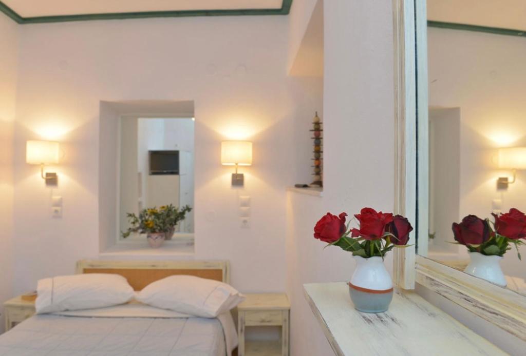 Postel nebo postele na pokoji v ubytování Anthousa Hotel