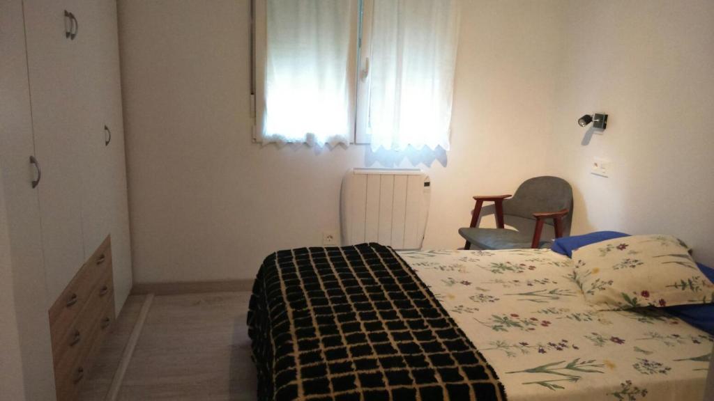 A bed or beds in a room at patio soleado DOS BAÑOS