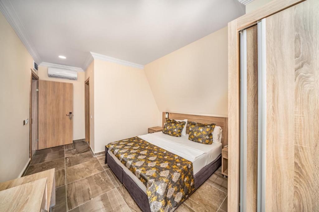 Postel nebo postele na pokoji v ubytování Arsi Paradise Beach Hotel