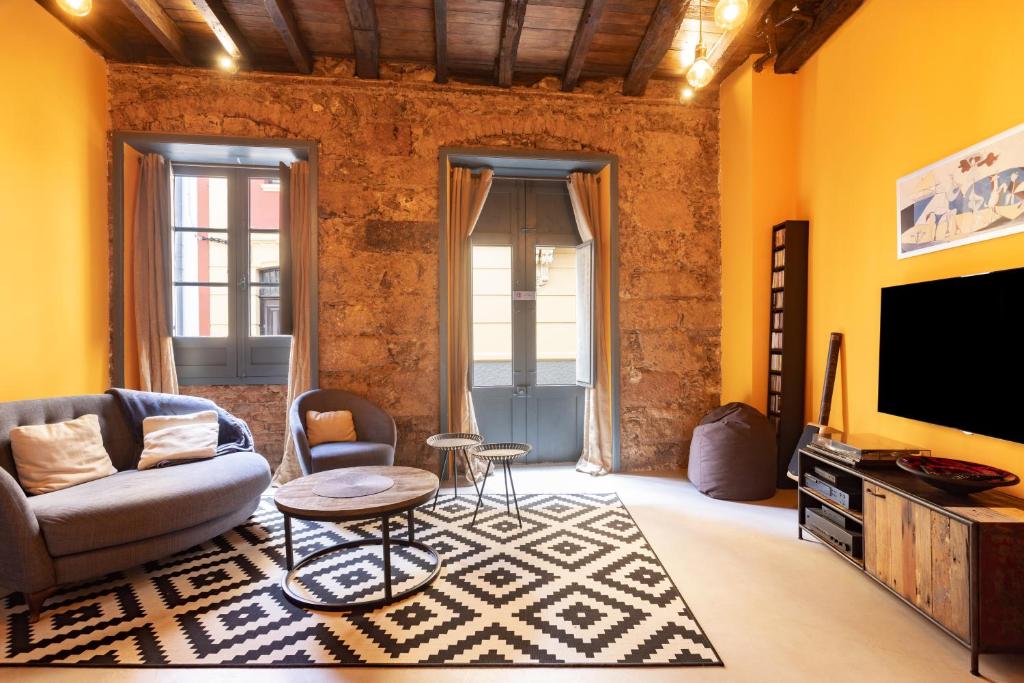 Televízia a/alebo spoločenská miestnosť v ubytovaní Home2Book Stylish Design House in La Laguna Center