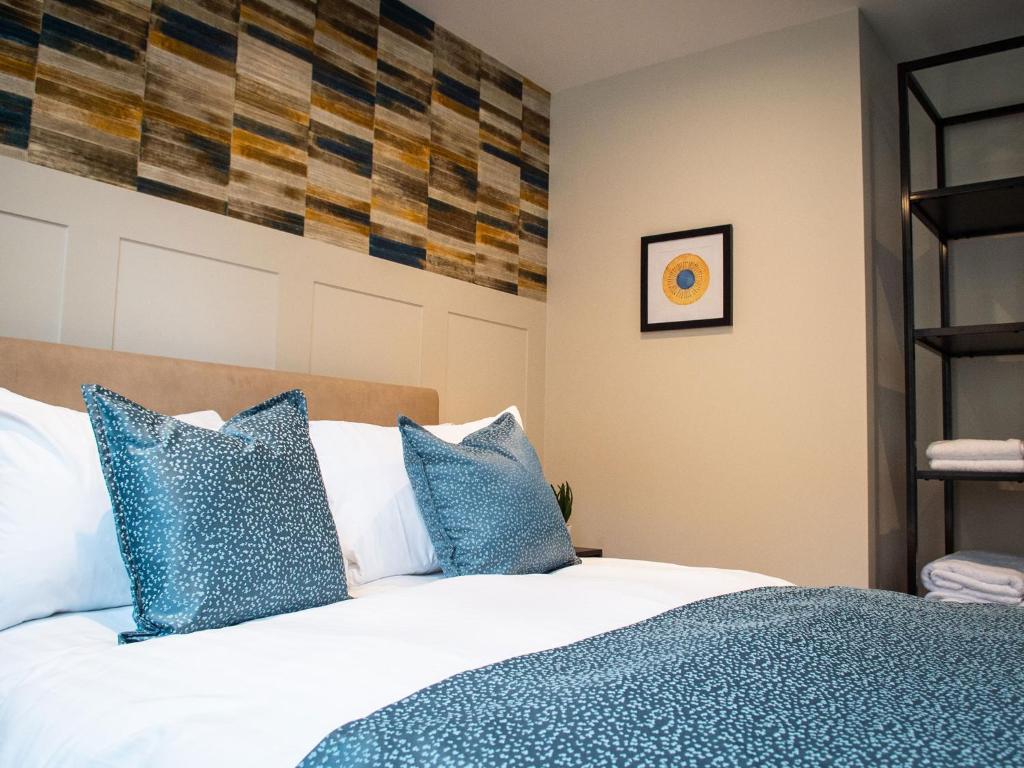 Postel nebo postele na pokoji v ubytování The Gresham Aparthotel