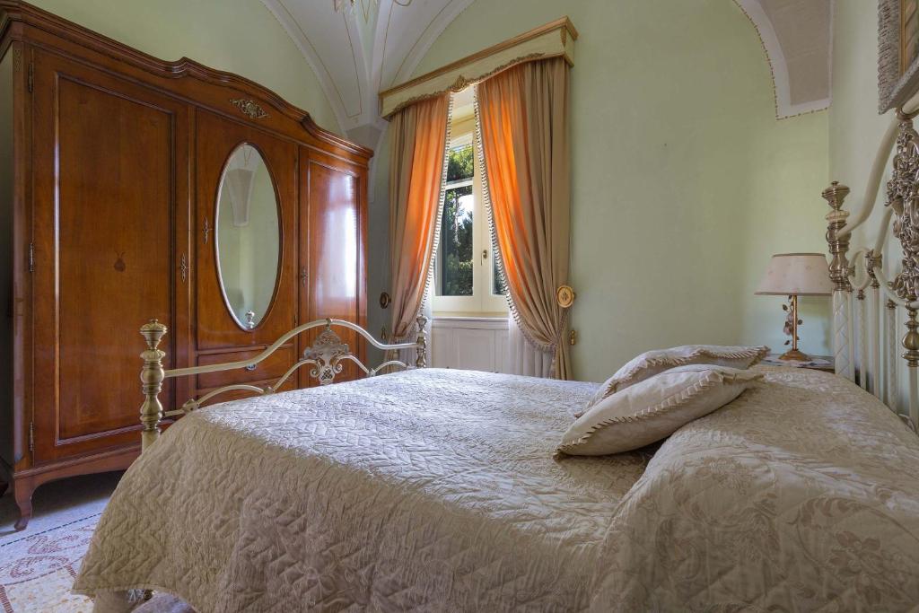 Łóżko lub łóżka w pokoju w obiekcie Villa Nicrys by Perle di Puglia