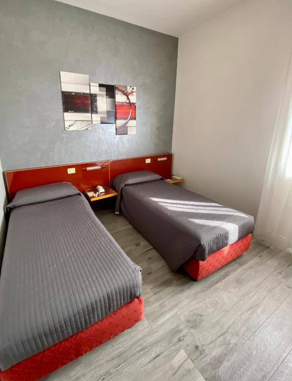 Postel nebo postele na pokoji v ubytování Hotel Master