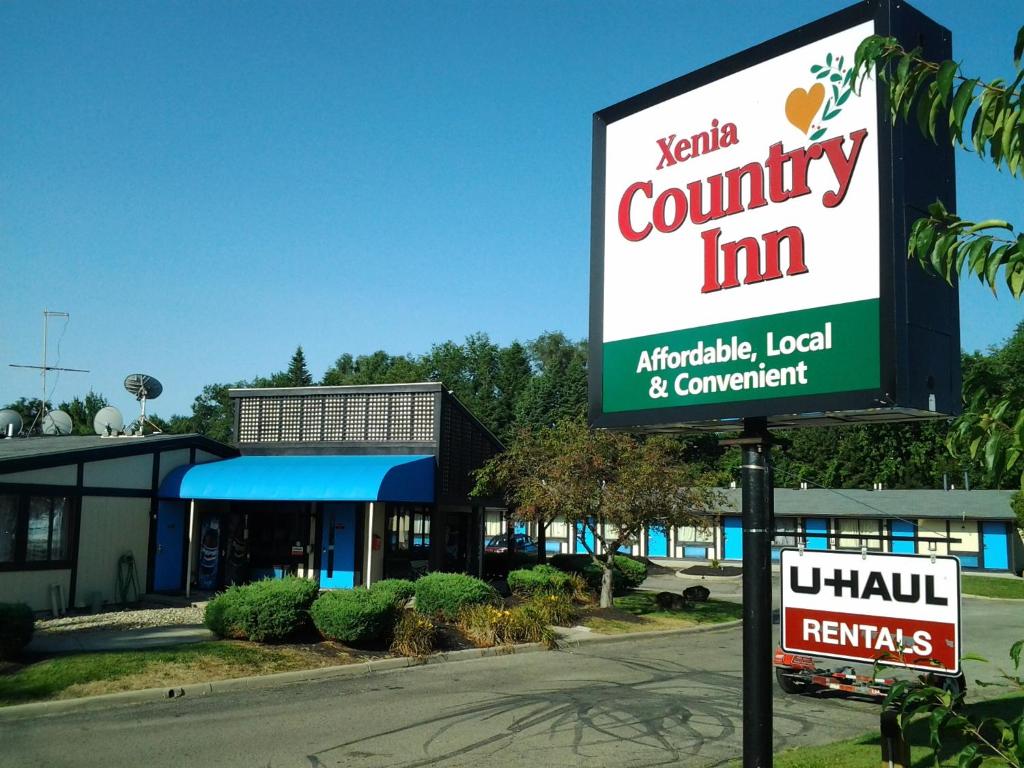 a sign for a community inn in front of a building at Xenia Country Inn in Xenia