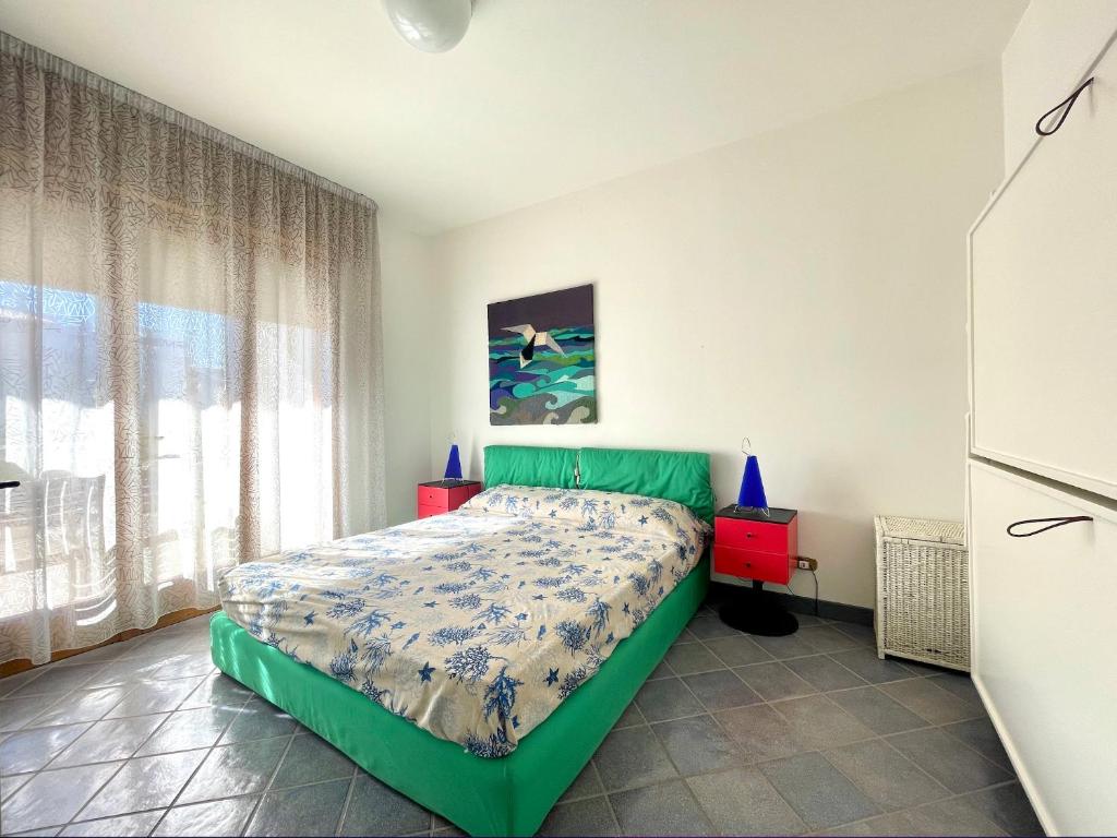 A bed or beds in a room at Appartamento Albatros - Carraro Immobiliare Jesolo - Family Apartments
