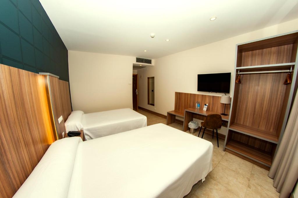 TV a/nebo společenská místnost v ubytování Hotel Camino Real