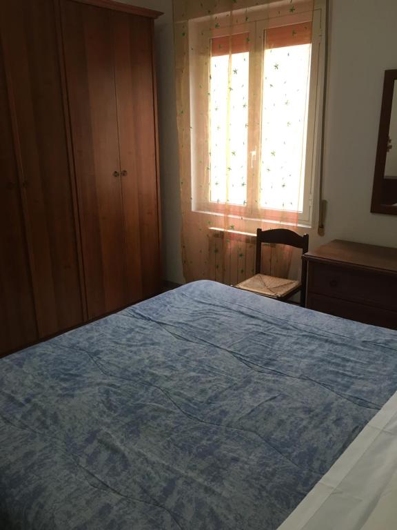A bed or beds in a room at Appartamento MIRAMARE, 2 camere, cucina, bagno,