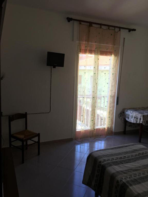 A bed or beds in a room at Appartamento MIRAMARE, 2 camere, cucina, bagno,