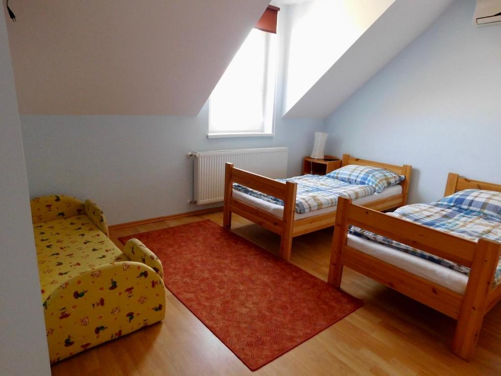 Postel nebo postele na pokoji v ubytování Csetáj Vendégház