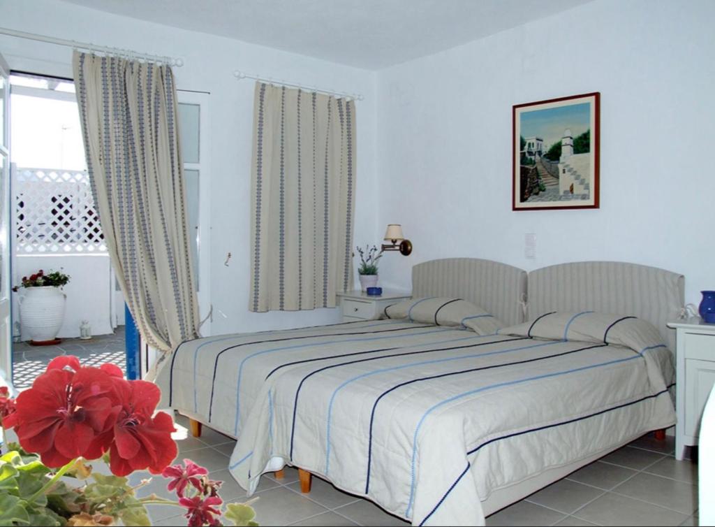 Postel nebo postele na pokoji v ubytování Anthousa Hotel