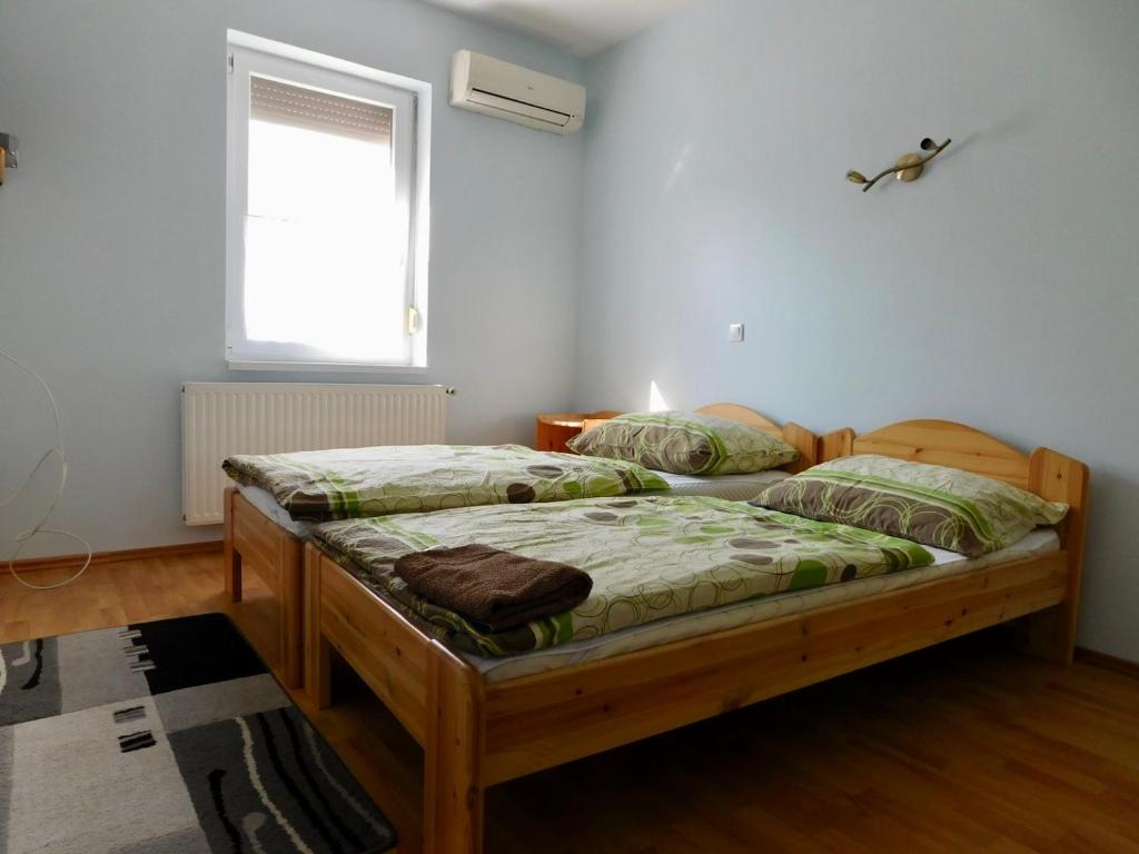 Postel nebo postele na pokoji v ubytování Csetáj Vendégház